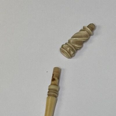 #3: Carved bone handle with a cap and missing parts