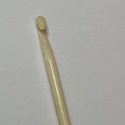 #8: A carved bone crochet hook all in one piece of bone. The shaft is elegantly simple