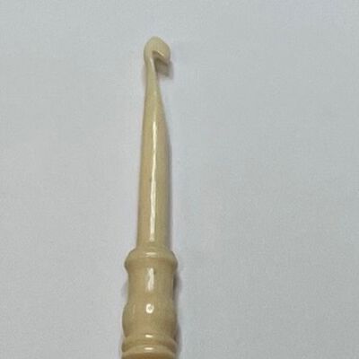 #7: Gracefully carved bone crochet hook