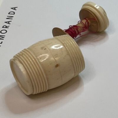 #1: Showing the barrel open with red thread wound around the staff