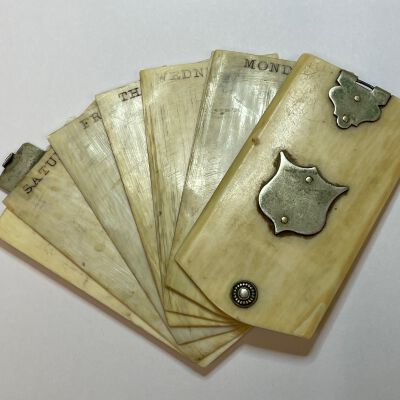 #3: Bone Aide Memoire with silver clasp and shield cover.  Each day of the week is at the top of each sheet