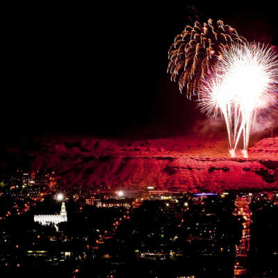 St. George at night with fireworks on the Red Hill