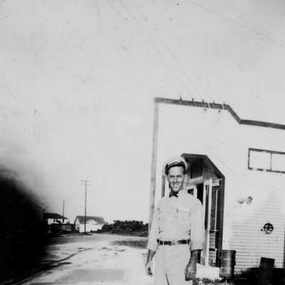 Louis Pellicier in front of gas station, Tavernier
