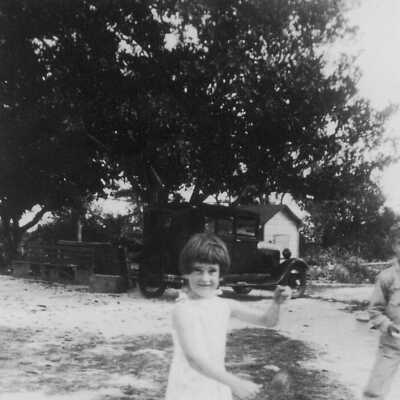 Marjorie Albury playing in the yard