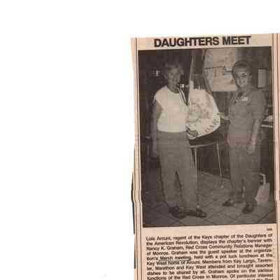 Newspaper Lois Arcuri, Regent and Nancy K. Graham Display Chapter's Banner