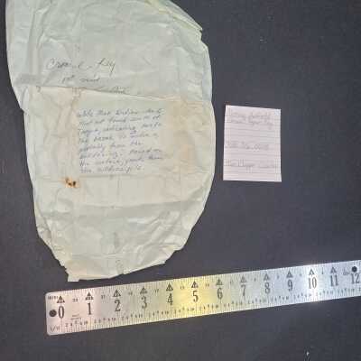 Missing Artifact/Green Paper Bag