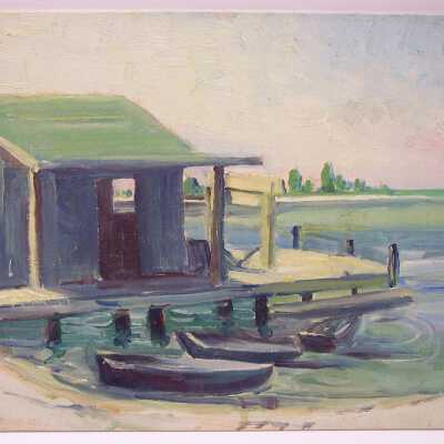 Untitled [boatdock with cabin and boats by water]