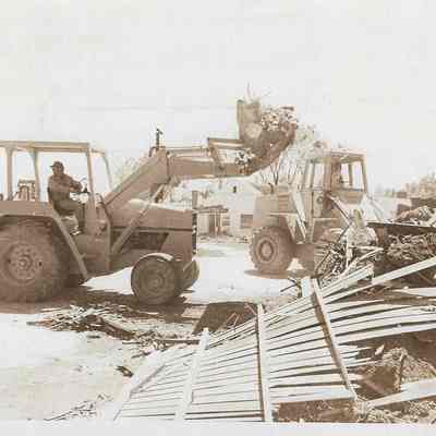 Heavy Equipment Moving Flood Debris