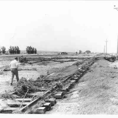 Railroad tracks covered debris