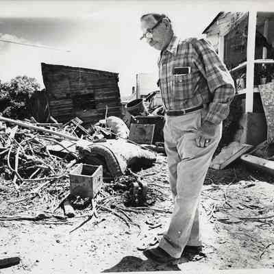 Man Assessing Flood Damage