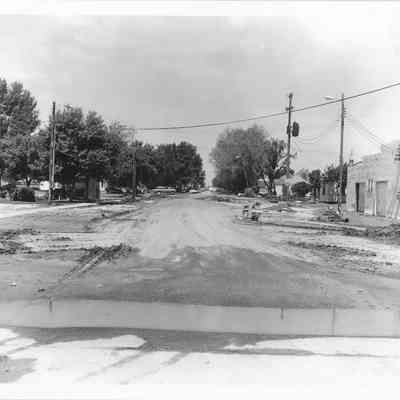 Dirt road with debris scattered around