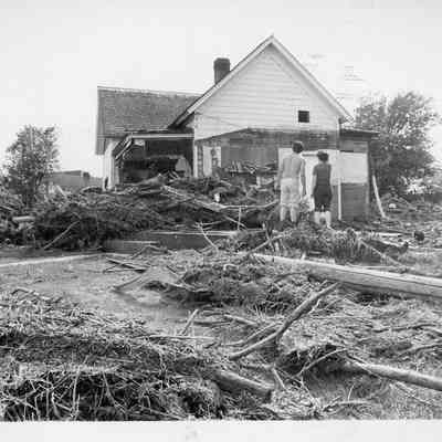 Couple outside Flooded Home