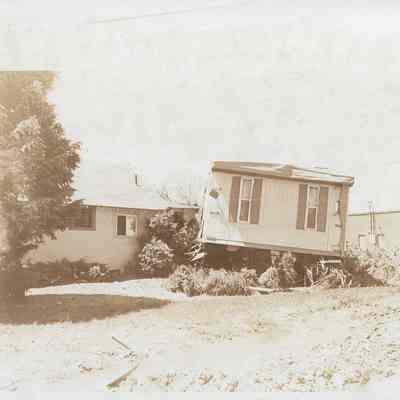 Trailer Home On Bushes and Debris
