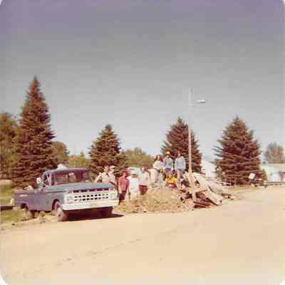 Blue Truck and People Posing for Camera
