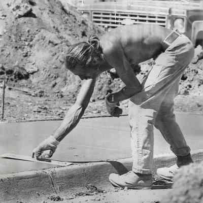 Man Scraping Cement