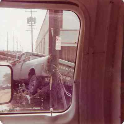 Truck that has been ran into Pole during flood