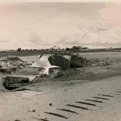 Car Burried Under Mud