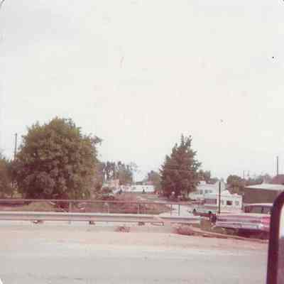 Partially Flooded Road with Subdivision Behind it