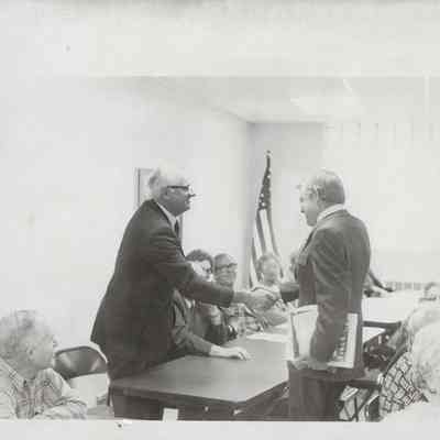 Two men Standing and Shaking Hands