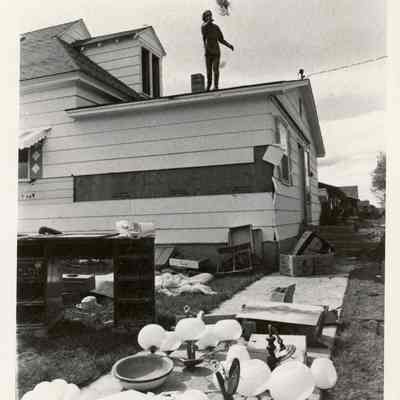 Person Removing Items From Home After Flood