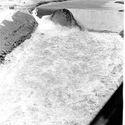 Long aerial view of Dam Breaking