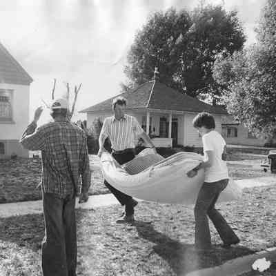 Men Moving Mattress