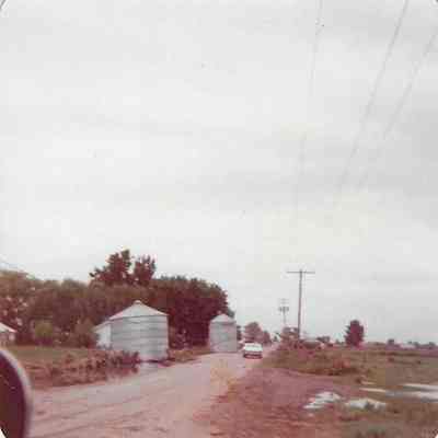 Dirt Road and Two Grain Silos
