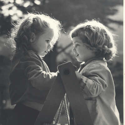 2 Girls reach the top of a ladder