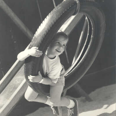 Girl swinging in tire
