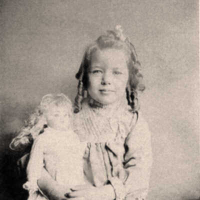 Lucile holding her doll