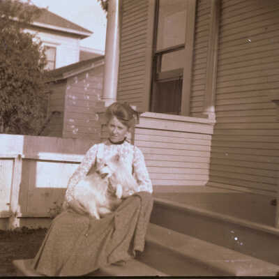 Lady on porch with dog