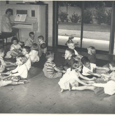 Children with music teacher