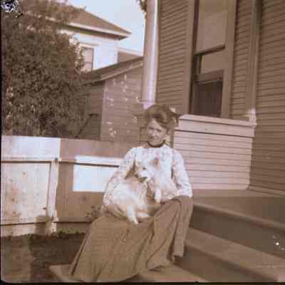Lady on porch with dog
