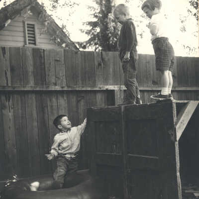 Children playing by a fence