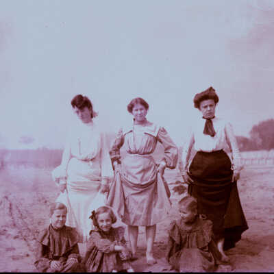 Women at beach with children