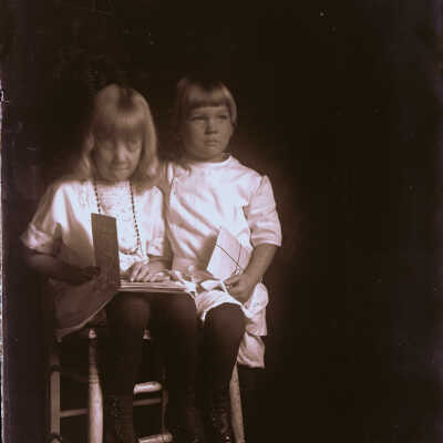 Children posed with chair