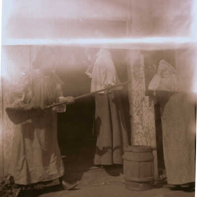 Woman pointing broom