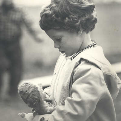 Girl holding doll
