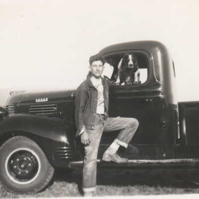 Boy, dog and pickup
