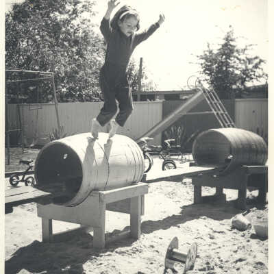 Girl jumping from barrel