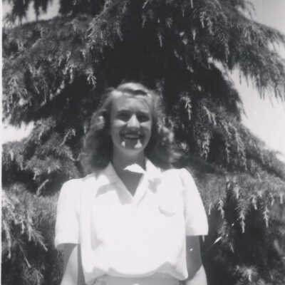 Girl by the pine tree