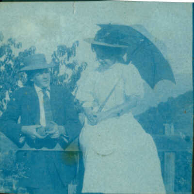 Couple with hats and parasol
