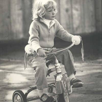 Girl on tricycle