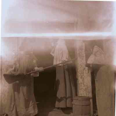Woman pointing broom