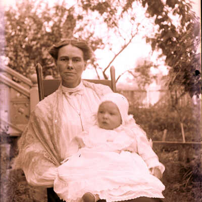 Seated lady holding baby