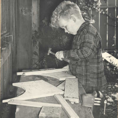 Boy with hammer and wood