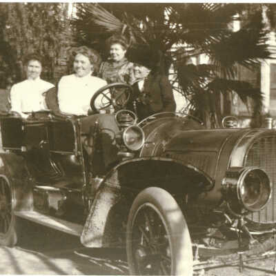Cilker women with their first automobile