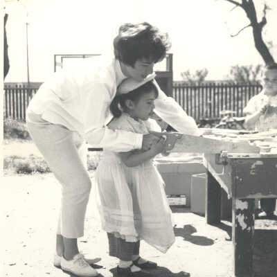 Girl sawing wood