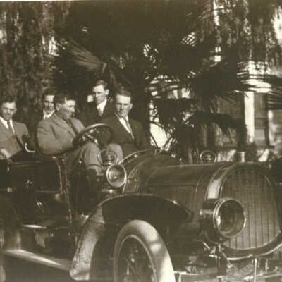 Cilker men with their first automobile