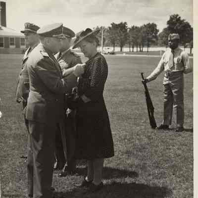 Stella Stover Receiving a Medal Awarded Posthumously for her Son.